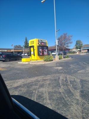 Outside his store