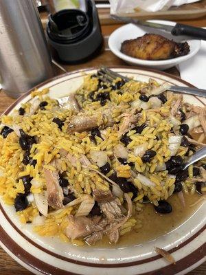 Yellow rice, black beans, and roasted pork with onion and Crystal hot sauce.  Mmmmmmm good.