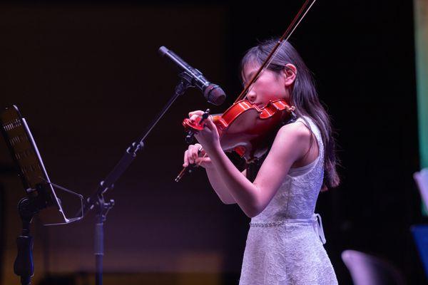 One of our incredible violin students performing at one of our Showcases!