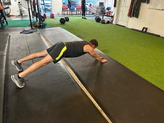 Plank with reach/hold