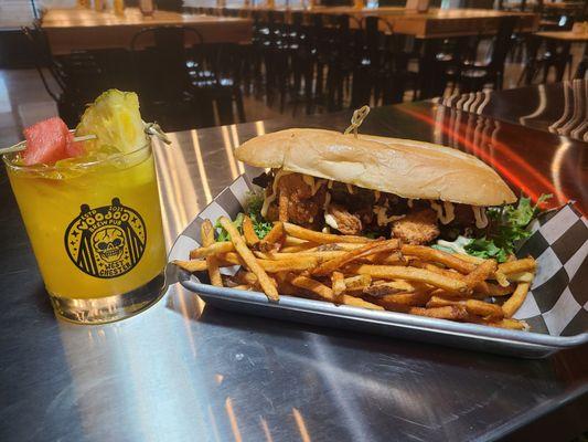 Bayou Po' Boy- fried chicken and shrimp served on a fresh roll with field greens house made charred tomato compote and house made bang bang