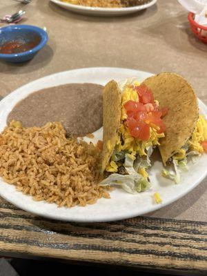 Two crunchy beef taco dinner with refried beans and rice