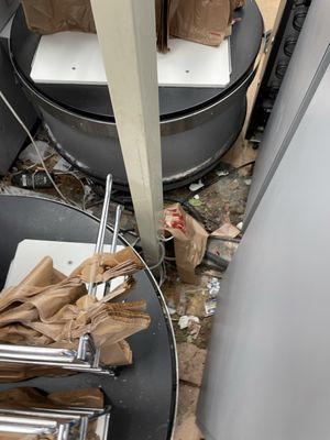 The self-checkout area, along with most of the store, is grimy and neglected.