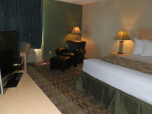 All king room with 37 inch LCD TV and leather easy chair