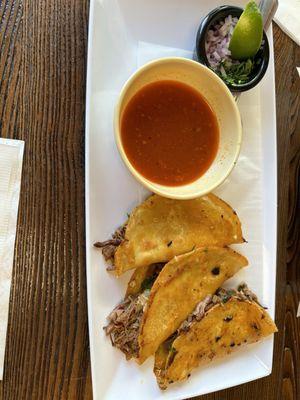 Quesabirria tacos and consome (birria broth)