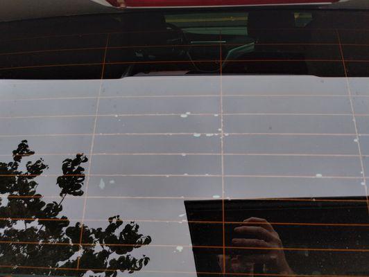 Center of rear glass.