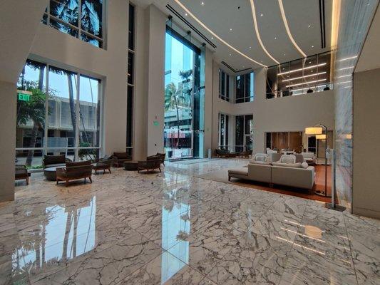 The back lobby of the condo building has a larger, brighter seating area