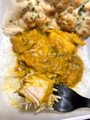 Chicken Curry over white rice, big chunks of juicy boneless chicken