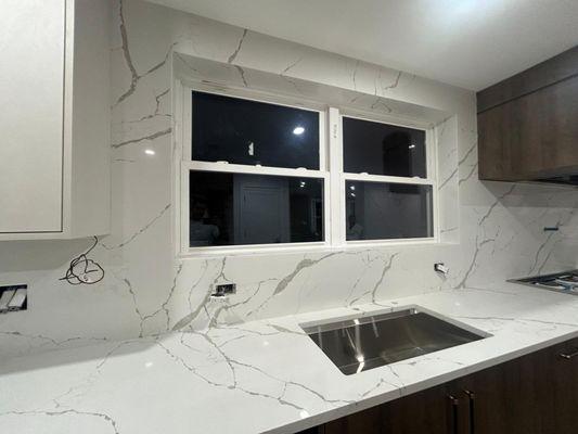 Quartz Counters and Full Backsplash wrapping around window