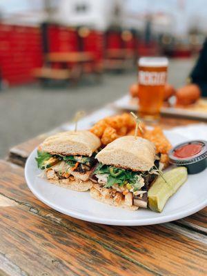 Chicken Bay Bridge Banh Mi with marinated portobello mushroom, pickled vegetables, jalapeños, cilantro, spicy aioli on a ciabatta roll