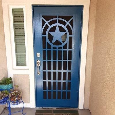 Professional security screen door installation for front door protection in Austin. Titan style pictured.