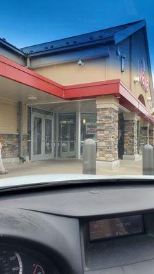 Front door of a Wawa with friendly people who seem to be overwhelmed.