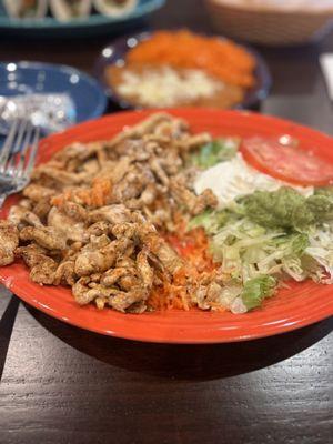 Arroz con Pollo . Delicious and piled high with grilled chicken and rice .