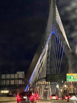 The Zakim Bridge looks like the strings of a Giant Harp. The futuristic multi lane Boston bridge connects commuters to many popular places