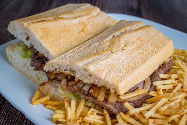 Grilled steak, sautéed onions, sliced tomato and crisp lettuce on our fresh baked baguette. Potato sticks on the side.