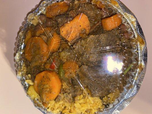 beef stew with yellow rice and beans