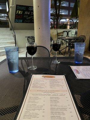 Wine on the patio, about to order our meals