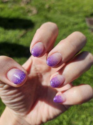 A fill to poly hard gel and purple fade gel polish with natural pink in the background.