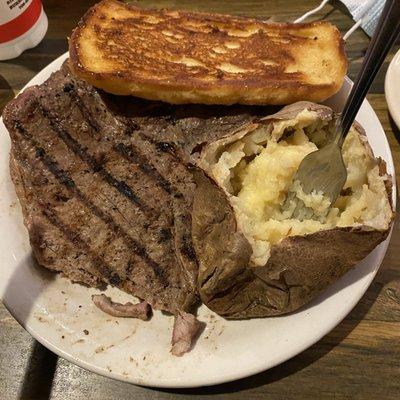 T-Bone Steak,Baked potato, and Garlic bread.  Why is this place still open.