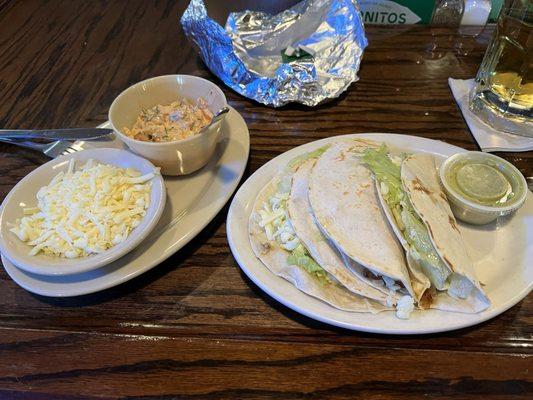 Fish tacos were really good. Come with a side of homemade creamy salsa and a refreshing (verde?) sauce.