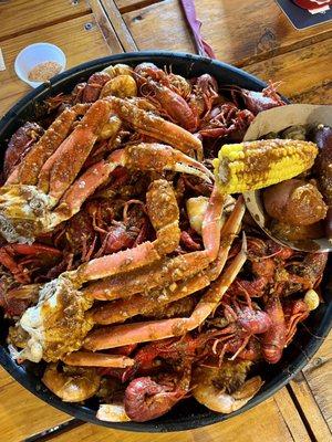 The Feast 3 pounds crawfish, 1pound jumbo shrimp, 2 snow crab clusters, sausages, corn, potatoes, mushrooms, fresh garlic cloves