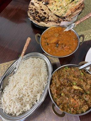 Bottom: baingan bartha  Middle: mixed veggie masala Top: garlic naan and aloo paratha