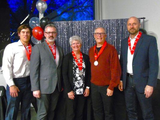 Accepting a platinum award at a Keller Williams awards banquet.