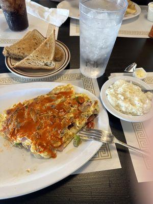 Country omelette, grits, and whole wheat toast.