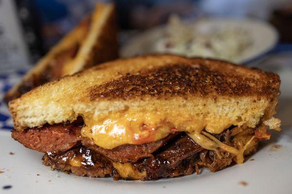 Brisket grilled cheese with sliced hot links