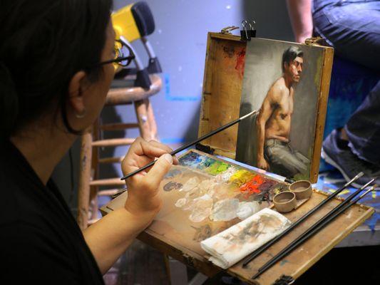 Painting with a live model.