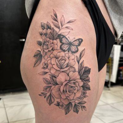 Fine line roses with butterfly hip tattoo.