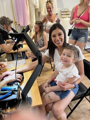 My daughter, getting her bracelet!