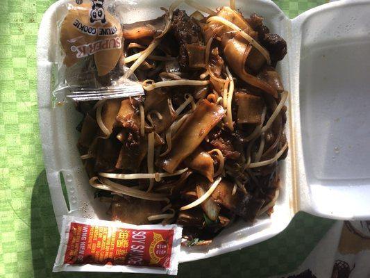 Beef chow fun (8.95) with genuine Chinese soy sauce.