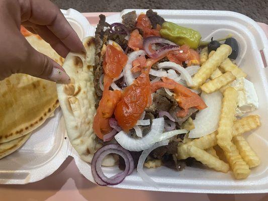 Super supreme gyro enough for 3 people comes with soup, tzatziki sauce, fixings, and fries or rice. Very good