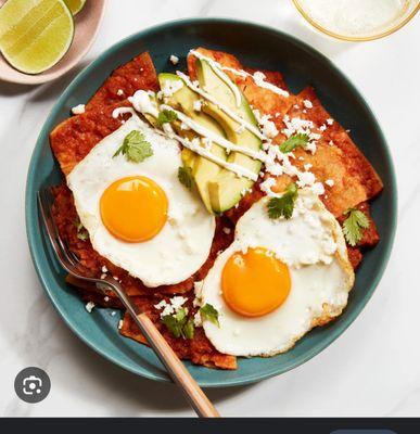 Chilaquiles with egg, eggs and avocado