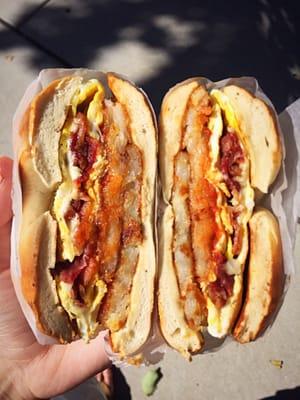 Bacon, egg, cheese, and hash browns on a bagel with saltpeppaketchup. OH YESSS.