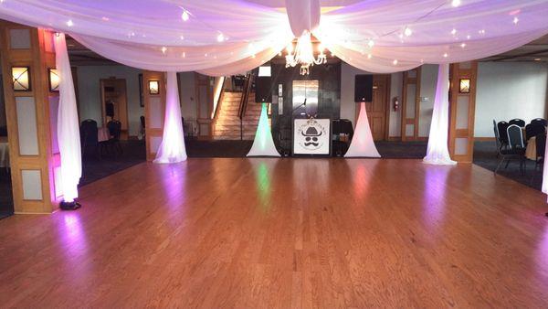 Wedding Event Example of Lighting.  Sheer material NOT included.  DJ Banner NOT used during weddings.