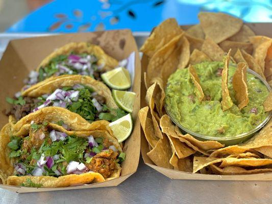 Carne asada  and chorizo with a side of guac and chips .