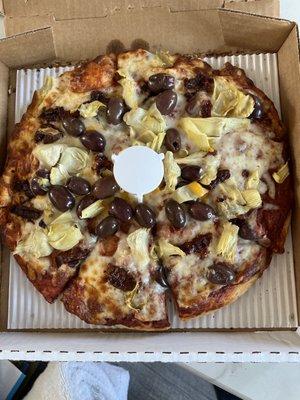 Small pizza with, Kalamata olives, sun dried tomatoes, artichoke hearts.