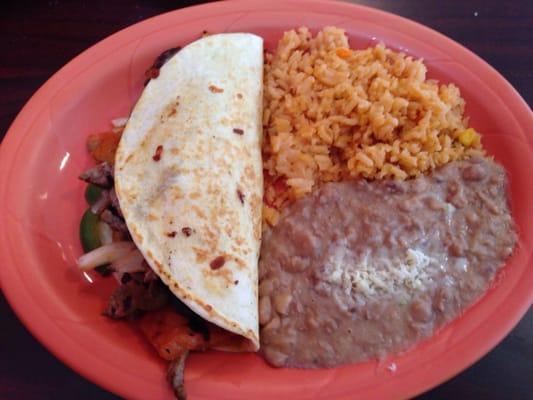 Steak Quesadilla with sides of Rice and Beans.