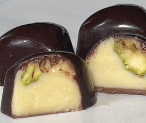 Caramelized white chocolate with butter and pistachios in dark fine chocolate