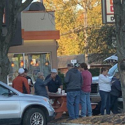 KINGSTON, NY: Kings tailgating in front of Dunkin' Donuts.. coffee in hand