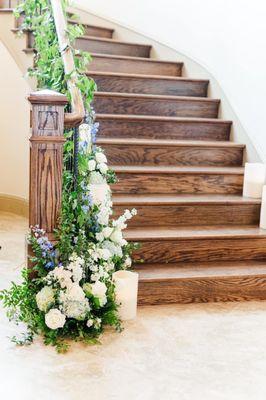 Florals on staircase at wedding