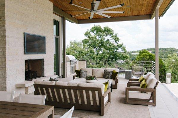 A weather-proof TV, surround-sound audio and a controlled fan makes for the perfect outdoor living space.