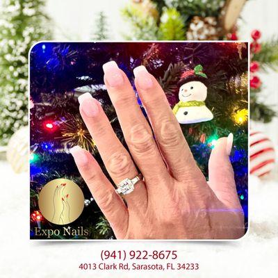 Elevate your holiday elegance with classic french nails, adding a timeless and sophisticated touch to your festive look this Christmas seaso