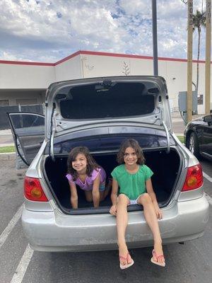 Kids in the trunk of a Toyota Corolla with 450,000 miles on it. And she is still rolling!!