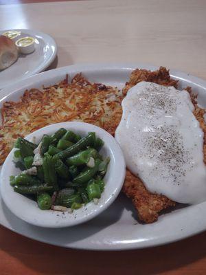 Chicken fried chicken hash browns and green beans and roll.