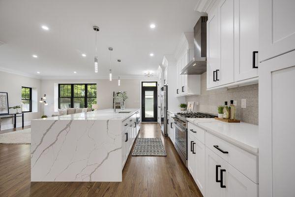 42" white Shaker with Crown and beautiful island with waterfall quartz countertop