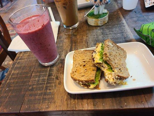 Curried chicken salad sandwich and mixed berry smoothie