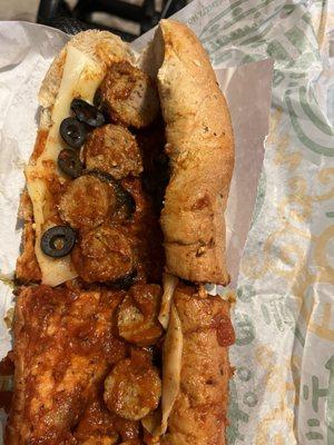 Meatball sub, meatballs cut in hslf